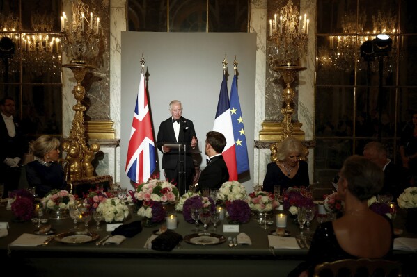 Britain's King Charles III delivers a speech during a state dinner in the Hall of Mirrors at the Chateau de Versailles, west of Paris, Wednesday, Sept. 20, 2023 in Versailles. President Emmanuel Macron and King Charles III held talks in Paris on Wednesday at the start of a long-awaited three-day state visit meant to highlight the friendship between France and the U.K. (Benoit Tessier/Pool via AP)