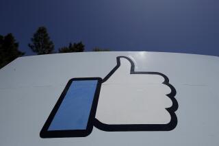 FILE - This April 25, 2019, file photo shows the thumbs-up "Like" logo on a sign at Facebook headquarters in Menlo Park, Calif. Facebook’s semi-independent oversight board says the company has failed to fully disclose information on its internal system that exempts high-profile users from some or all of its content rules. Facebook “has not been fully forthcoming” with the overseers about its “XCheck,” or cross-check, system the board said in a report Thursday, Oct. 21, 2021. (AP Photo/Jeff Chiu, File)