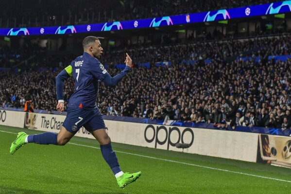 PSG's Kylian Mbappe celebrates after scoring his side's opening goal during the Champions League round of 16 second leg soccer match between Real Sociedad and Paris Saint-Germain, at the Reala Arena stadium in San Sebastian, Spain, Tuesday, March 5, 2024. (AP Photo/Alvaro Barrientos)