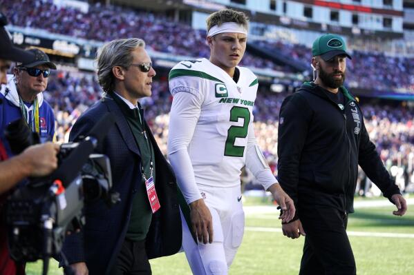 FILE - In this Sunday, Oct. 24, 2021, file photo, New York Jets quarterback  Mike White (5) looks to hand off the ball during an NFL football game  against the New England