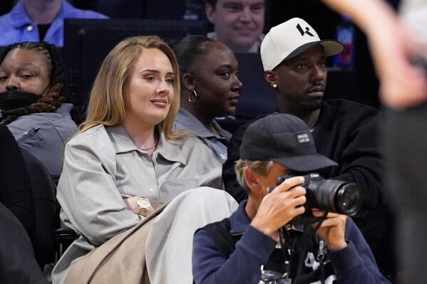 Singer Adele, left, and sports agent Rich Paul watch during the second half in Game 1 of an NBA first-round playoff series between the Los Angeles Lakers and the Minnesota Timberwolves, Saturday, April 19, 2025, in Los Angeles. (AP Photo/Mark J. Terrill)