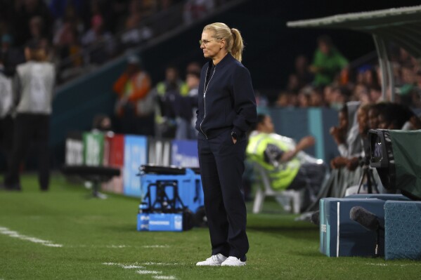 England's head coach Sarina Wiegman looks at the Women's World Cup round of 16 soccer match between England and Nigeria in Brisbane, Australia, Monday, Aug. 7, 2023. (AP Photo/Tertius Pickard)