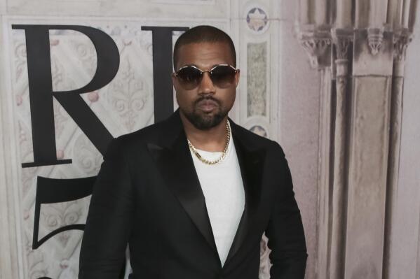FILE - In this Sept. 7, 2018, file photo, Kanye West attends the Ralph Lauren 50th Anniversary Event held at Bethesda Terrace in Central Park during New York Fashion Week in New York.  West appeared to reignite a feud with the fellow rapper in a series of tweets on Thursday, Dec. 13, 2018,  in which he claimed Drake had called trying to threaten him.   (Photo by Brent N. Clarke/Invision/AP, File)