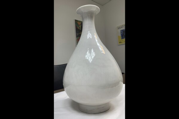 In this photo issued by the Metropolitan Police on Saturday, Aug. 19, 2023, a view of a Chinese vase which dates back to the Yongle period of the Ming Dynasty. A sting operation at a London hotel helped authorities recover a 15th-century Chinese vase worth about 2 million pounds ($2.5 million) and break up the criminal ring believed to have stolen the artifact from a Swiss museum, British police said Saturday. (Metropolitan Police via AP)