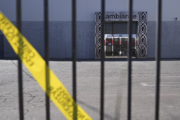 Caution tape hangs outside Ambiance Apparel after federal immigration authorities conducted an operation on Friday, June 6, 2025, in Los Angeles. (AP Photo/Jae C. Hong, File)
