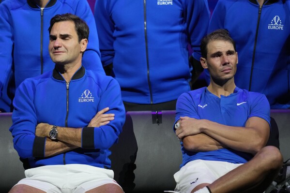 FILE - An emotional Roger Federer, left, of Team Europe sits alongside his playing partner Rafael Nadal after their Laver Cup doubles match against Team World's Jack Sock and Frances Tiafoe at the O2 arena in London, Friday, Sept. 23, 2022. That was the last match of Federer's career. It’s not just Nadal who has folks wondering how many more tennis matches remain in his career.(AP Photo/Kin Cheung, File)