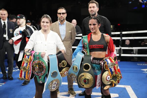 Ireland's Katie Taylor, left, poses for photographs with Puerto Rico's Amanda Serrano after Serrano won a women's featherweight championship boxing bout against Mexico's Erika Cruz Hernandez Saturday, Feb. 4, 2023 in New York. Taylor will fight Serrano Saturday May 20, 2023 in Ireland. (AP Photo/Frank Franklin II)