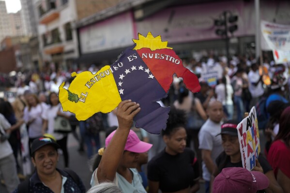 Venezuelans vote in a referendum to assert sovereignty of a giant territory beneath dispute with Guyana