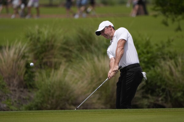 Rory McIlroy, of Northern Ireland, chips onto the second green during the final round of the PGA Zurich Classic golf tournament at TPC Louisiana in Avondale, La., Sunday, April 28, 2024. (AP Photo/Gerald Herbert)