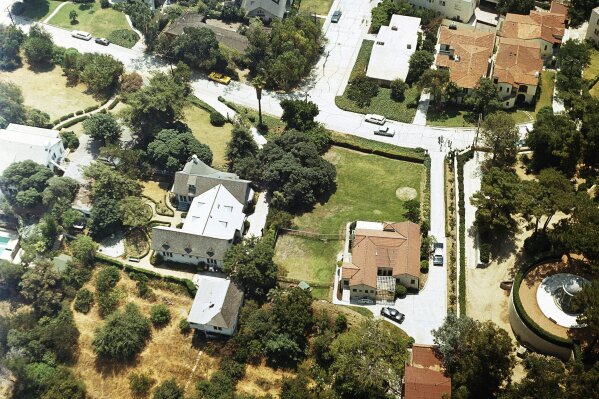 FILE - In this Aug. 13, 1969 file photo an aerial view of the home of Leno and Rosemary LaBianca in the Los Feliz district of Los Angeles. The home, which is one of the Los Angeles houses where followers of Charles Manson committed notorious murders in 1969, is for sale. (AP Photo, File)