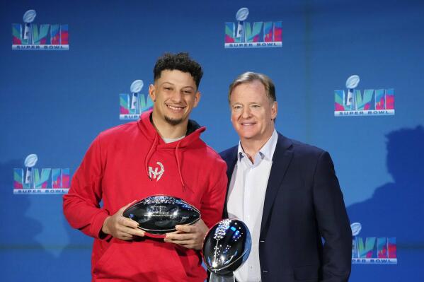 Kansas City Chiefs quarterback Patrick Mahomes, left, holds up the Super Bowl MVP Trophy as he stands next to NFL Commissioner Roger Goodell during an NFL Super Bowl football news conference in Phoenix, Monday, Feb. 13, 2023. The Chiefs defeated the Philadelphia Eagles 38-35 in Super Bowl LVII. (AP Photo/Ross D. Franklin)