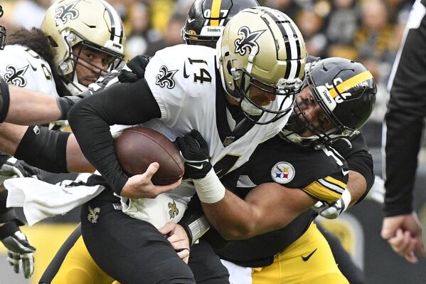 New Orleans Saints quarterback Andy Dalton (14) is sacked by Pittsburgh Steelers linebacker Alex Highsmith during the first half of an NFL football game in Pittsburgh, Sunday, Nov. 13, 2022. (AP Photo/Don Wright)