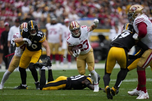 San Francisco 49ers running back Christian McCaffrey (23) runs with the ball against the Pittsburgh Steelers during the first half of an NFL football game, Sunday, Sept. 10, 2023, in Pittsburgh. (AP Photo/Gene J. Puskar)