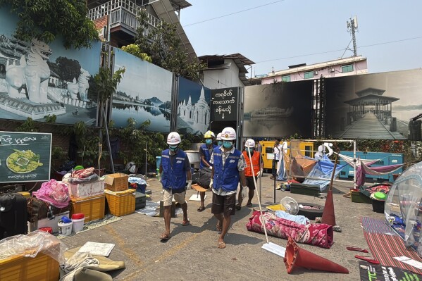 Rescuers carry the body of a victim, from a collapsed building in the aftermath of Friday's earthquake in Mandalay, Myanmar, Thursday, April 3, 2025. (AP Photo)
