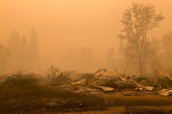 FILE - Fire damage is seen, Sept. 12, 2020, in Mill City, Ore. On Tuesday, March 5, 2024, a jury in Oregon ordered PacifiCorp to pay more than $42 million to 10 victims of devastating wildfires on Labor Day 2020 — the latest verdict in litigation that is expected to see the electric utility on the hook for billions in damages. (AP Photo/Gillian Flaccus, File)