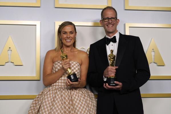 Dana Murray, left, and Pete Docter, winners of the award for animated feature film for "Soul," pose in the press room at the Oscars on Sunday, April 25, 2021, at Union Station in Los Angeles. (AP Photo/Chris Pizzello, Pool)