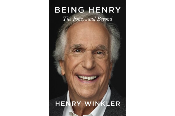 This cover image released by Celadon Books shows "Being Henry: The Fonz...and Beyond" by Henry Winkler. (Celadon Books via AP)
