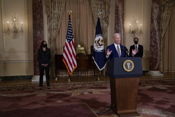 Vice President Kamala Harris, left, and Secretary of State Antony Blinken, right, listen as President Joe Biden delivers a speech on foreign policy, at the State Department, Thursday, Feb. 4, 2021, in Washington. (AP Photo/Evan Vucci)