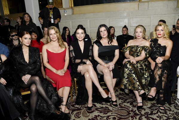 Ashlee Simpson, left, Alicia Silverstone, Sophia Bush, Melanie Lynskey, J. Smith Cameron and Busy Phillips attend the Christian Siriano Fall/Winter 2024 show at the Plaza Hotel during New York Fashion Week on Thursday, February 8, 2024. in New York.  (Photo by Evan Agostini/Invision/AP)
