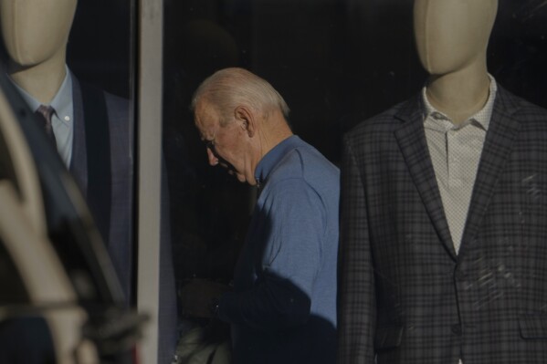 President Joe Biden is seen shopping inside Jos A. Bank in Greenville, Del.,Saturday, Nov. 18, 2023. (AP Photo/Manuel Balce Ceneta)