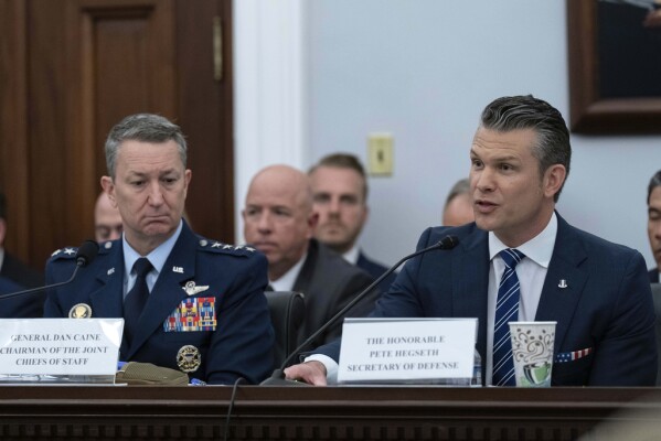 Department of Defense Secretary Pete Hegseth, right, accompanied by Chairman of the Joint Chiefs of Staff General Dan Caine, testifies before the House Committee on Appropriations subcommittee oversight hearing on the Department of Defense, on Capitol Hill.