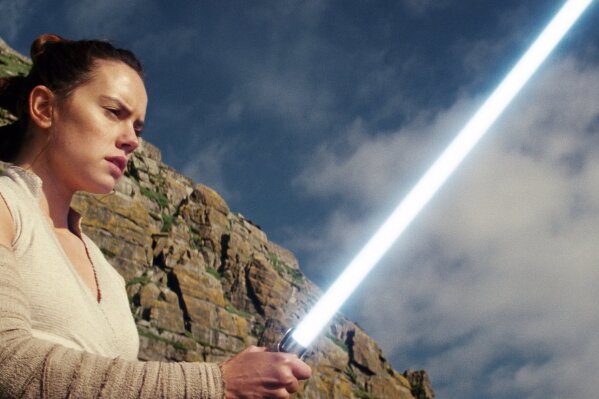 
              This image released by Lucasfilm shows Daisy Ridley as Rey in "Star Wars: The Last Jedi." The Skywalker saga may be coming to an end this December as the latest Star Wars trilogy finishes, but 8 months out from its release fans still know precious little about what director J.J. Abrams and Lucasfilm president Kathleen Kennedy have in store for “Episode IX," which opens nationwide on Dec. 20.  (Lucasfilm via AP)
            