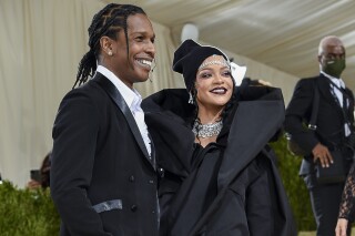 FILE - A$AP Rocky, left, and Rihanna attend The Metropolitan Museum of Art's Costume Institute benefit gala celebrating the opening of the "In America: A Lexicon of Fashion" exhibition in New York on Sept. 13, 2021. The pair are giving the world the first look at their second child together, a boy they've named Riot Rose. The couple dropped photos Tuesday of their family of four, including their second son, who was born Aug. 1, according to People and other reports. The couple's first child, RZA, was born in May 2022. (Photo by Evan Agostini/Invision/AP, File)