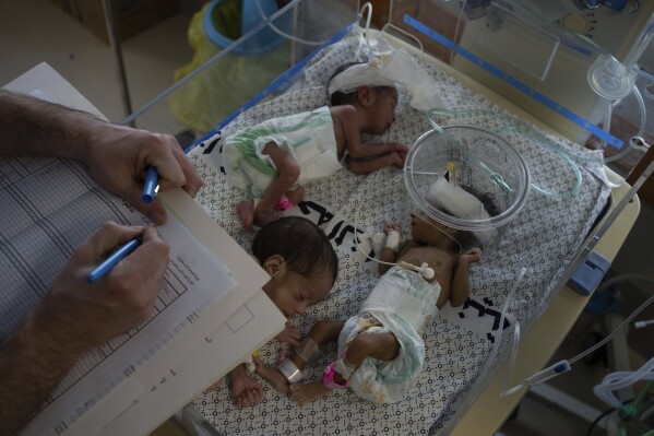 Medics prepare premature babies for transport to Egypt after they were evacuated from Shifa Hospital in Gaza City to a hospital in Rafah, Gaza Strip, Monday, Nov. 20, 2023. (AP Photo/Fatima Shbair)