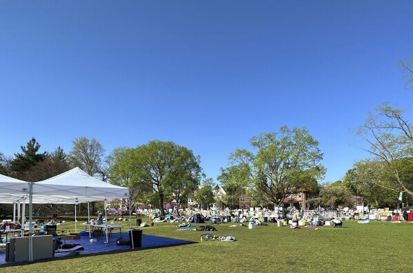 Tents, flags and other supplies remain at Deering Meadow on the campus of Northwestern University in Evanston, Ill., Tuesday, April 30, 2024, a day after university and protest organizers announced a deal that largely ended days-long anti-war protests.  (AP Photo/Melissa Perez Winder)