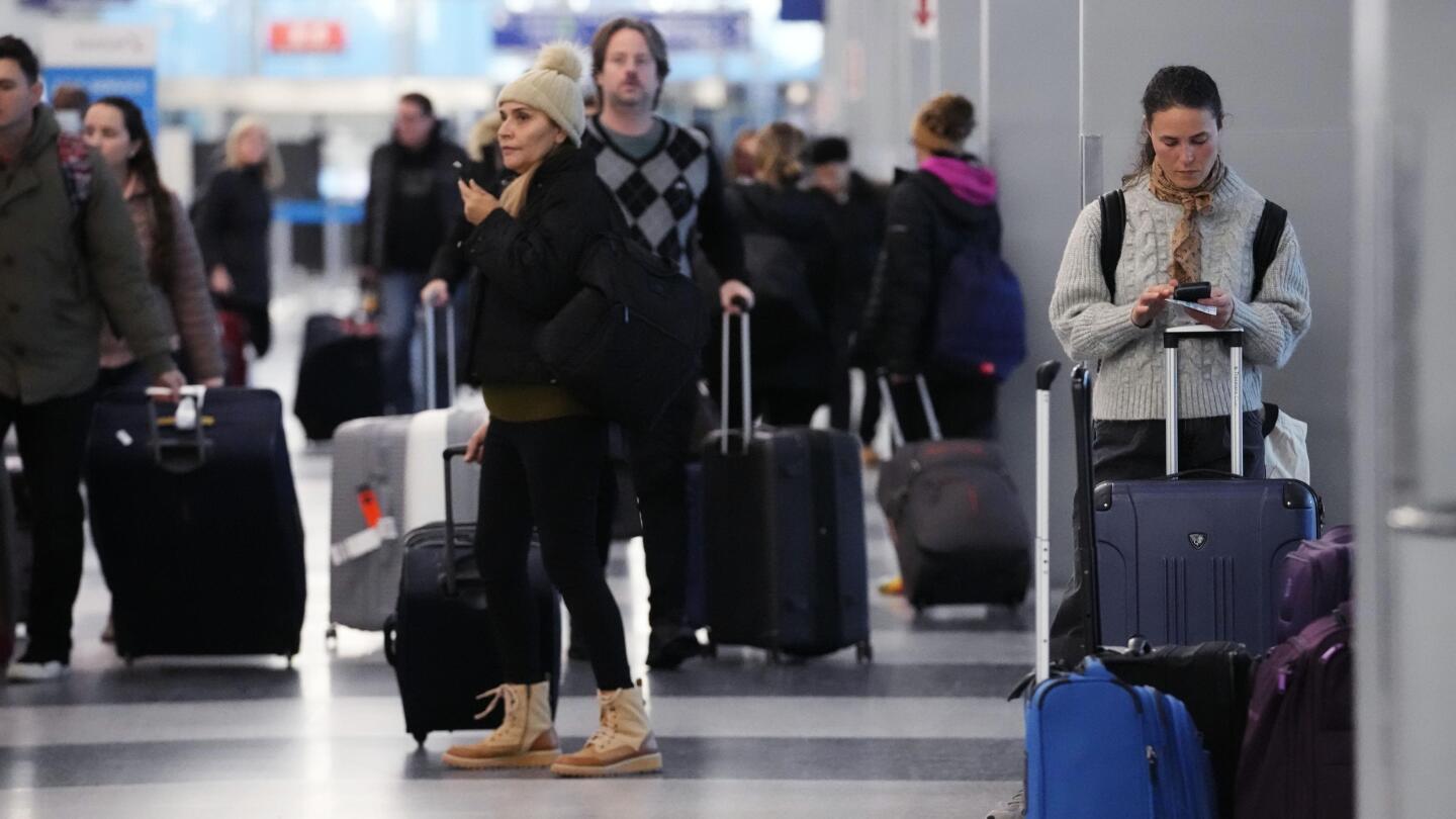 Holiday travel upended as forecasters warn of 'bomb cyclone'