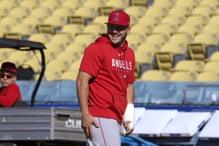 Los Angeles Angels Mike Trout laughs during batting practice prior to a baseball game against the Los Angeles Dodgers Friday, July 7, 2023, in Los Angeles. (AP Photo/Mark J. Terrill)
