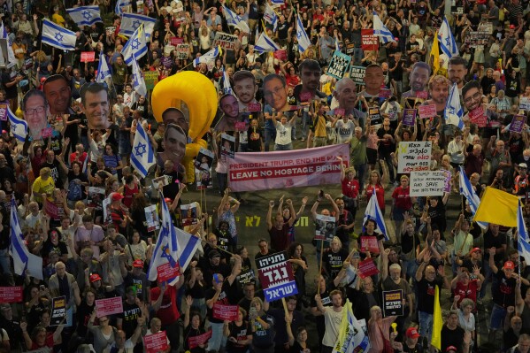 People take part in a protest demanding the end of the war and immediate release of hostages held by Hamas in the Gaza Strip, and against Prime Minister Benjamin Netanyahu's government in Tel Aviv, Saturday, May 31, 2025. (AP Photo/Ariel Schalit)