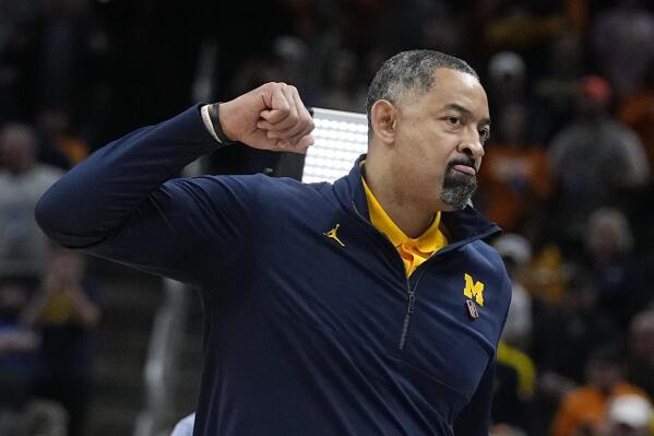 Michigan head coach Juwan Howard reacts after his team defeated Tennessee in a college basketball game in the second round of the NCAA tournament, Saturday, March 19, 2022, in Indianapolis. (AP Photo/Darron Cummings)
