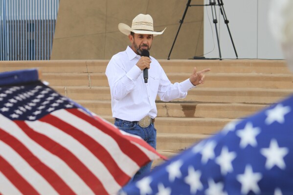 FILE - Couy Griffin, a former Otero County commissioner and cofounder of Cowboys for Trump, speaks during a gun rights rally in Albuquerque, New Mexico, Sept. 12, 2023. The Supreme Court has rejected an appeal by a former New Mexico county commissioner banished from public office for participating in the Jan. 6 Capitol insurrection. The court’s order Monday means former Otero County commissioner Couy Griffin remains disqualified from public office under a constitutional provision designed to prevent ex-Confederates from serving in government after the Civil War. (AP Photo/Susan Montoya Bryan, File)