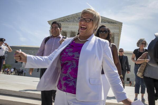 Amy Hagstrom Miller, founder of Whole Woman's Health, a Texas women's health clinic that provides abortions, rejoices as she leaves the Supreme Court in Washington, Monday, June 27, 2016, as the justices struck down the strict Texas anti-abortion restriction law known as HB2. The justices voted 5-3 in favor of Texas clinics that had argued the regulations were a thinly veiled attempt to make it harder for women to get an abortion in the nation's second-most populous state. The case is Whole Woman's Health v. Hellerstedt. (AP Photo/J. Scott Applewhite)