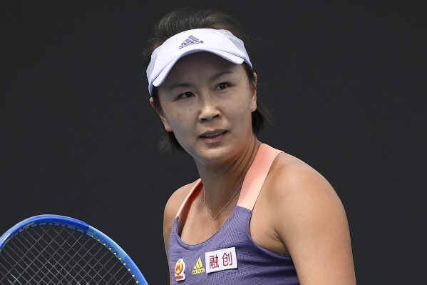 FILE - China's Peng Shuai reacts during her first round singles match against Japan's Nao Hibino at the Australian Open tennis championship in Melbourne, Australia on Jan. 21, 2020. A four-year absence of elite women’s tennis in China is set to end with the Women’s Tennis Association holding seven tournaments in the next six weeks as part of the tour’s Asian swing. After tournaments in China were cancelled due to COVID-19 travel restrictions in 2020, the WTA suspended events in the country in December 2021 over concerns about Grand Slam doubles champion Peng Shuai’s well-being after the Chinese player made sexual assault accusations against a high-ranking Chinese government official.(AP Photo/Andy Brownbill, File)