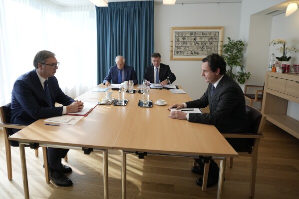 From left, Serbia's President Aleksandar Vucic, European Union foreign policy chief Josep Borrell, EU Special Representative Miroslav Lajcak and Kosovo's Prime Minister Albin Kurti meet together in Brussels, Thursday, Sept. 14, 2023. The leaders of Serbia and Kosovo are holding a fresh round of meetings on Thursday aimed at improving their strained relations as calls mount for a change in the Western diplomatic approach toward them amid concern that their tensions could spiral out of control. (AP Photo/Virginia Mayo)