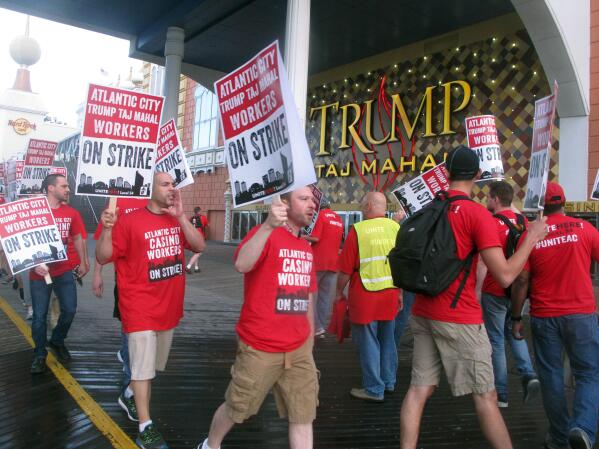 Union members picket outside the Trump Taj Mahal casino in Atlantic City N.J. on July 1, 2016 moments after they began a strike against the casino. On May 20, 2022, the union launched a web site warning casino customers that "labor disputes" could happen if the casinos don't reach new contracts by the May 31 deadline. (AP Photo/Wayne Parry)
