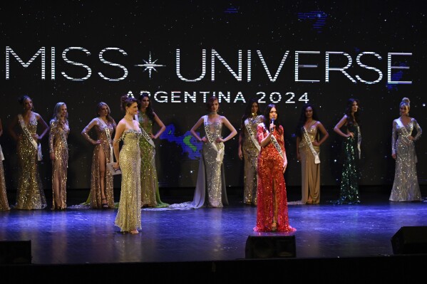Contestant Alejandra Rodriguez, right center, competes in the Argentina Miss Universe pageant, in Buenos Aires, Argentina, Saturday, May 25, 2024. The 60-year-old lawyer is hoping to make history by becoming the oldest Miss Universe contestant. (AP Photo/Gustavo Garello)
