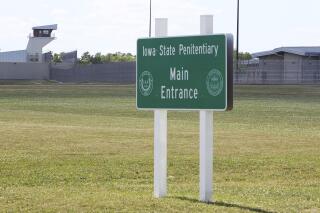 FILE - This July 1, 2017 file photo, shows the Iowa State Penitentiary in Fort Madison, Iowa. One of two Iowa prison nurses fired for accidentally giving dozens of inmates large overdoses of the coronavirus vaccine is appealing her termination, arguing she is "blameless" for the mix-up. The Iowa Department of Corrections fired Amanda Dodson, a registered nurse at the maximum-security Iowa State Penitentiary in Fort Madison, after an investigation found dozens of inmates received shots containing up to six times the recommended dose of the Pfizer vaccine. (John Lovretta//The Hawk Eye via AP, File)