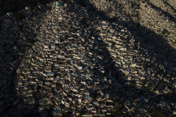 An aerial view of the Jalouise neighborhood at sunrise in Port-au-Prince, Haiti, Tuesday, Oct. 19, 2021. (AP Photo/Matias Delacroix)