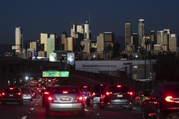 File - Traffic moves along the 110 Freeway in Los Angeles, Tuesday, Nov. 22, 2022. If the auto industry boosts electric vehicle sales to the level the Environmental Protection Agency recommends, any reduction in pollution could prove more modest than the agency expects. The Associated Press has estimated that nearly 80% of vehicles being driven in the U.S. — more than 200 million — would still run on gasoline or diesel fuel. (AP Photo/Jae C. Hong, File)
