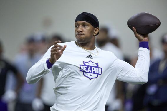 Washington quarterback Michael Penix Jr. passes during the NCAA college's NFL football pro day, Thursday, March 28, 2024, in Seattle. (AP Photo/John Froschauer)