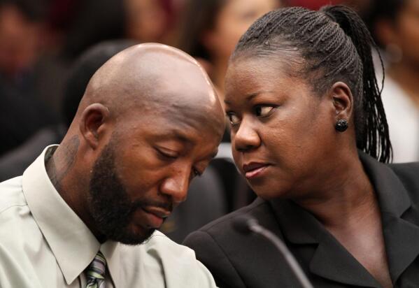 Trayvon Martin's parents, father, Tracy Martin, left, and mother Sybrina Fulton, attend a House Judiciary Committee briefing on racial profiling and hate crimes, Tuesday, March 27, 2012, on Capitol Hill in Washington. (AP Photo/Jacquelyn Martin)