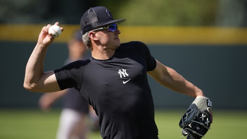 New York Yankees third baseman Josh Donaldson warms up for the team's baseball game against the Colorado Rockies on Saturday, July 15, 2023, in Denver.(AP Photo/David Zalubowski)