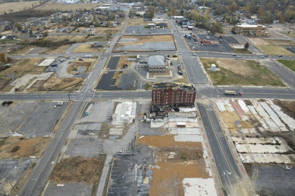 A tornado damaged building stands amid empty lots, Thursday, Nov. 9, 2023, in Mayfield, Ky. In December 2021, a tornado destroyed parts of the town and killed dozens. (AP Photo/Joshua A. Bickel)