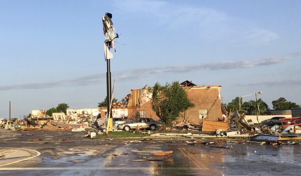 
              Debris lies on the ground at a motel after a deadly storm moved though the area in El Reno, Okla., Sunday, May 26, 2019. The storm destroyed the motel and roared through a nearby mobile home park and caused significant damage in the Oklahoma City area, officials said Sunday. (AP Photo/Tim Talley)
            