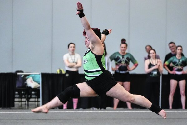 Raiden Hung of Jurassic Gymnastics from Boston, competes in the floor exercise at the 2025 NAIGC national competition in Pittsburgh, Friday, April 4, 2025. (AP Photo/Gene J. Puskar)