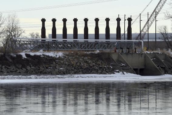 FILE - The Northwestern Energy's Laurel Generating Station, a natural gas-fired power plant, is seen under construction near Laurel, Mont., on March 10, 2016. NorthWestern Energy will resume construction of the plant along the Yellowstone River following a two month delay, after a judge revived a pollution permit for the project despite lingering concerns over its climate-changing emissions. (Larry Mayer/The Billings Gazette via AP, File)