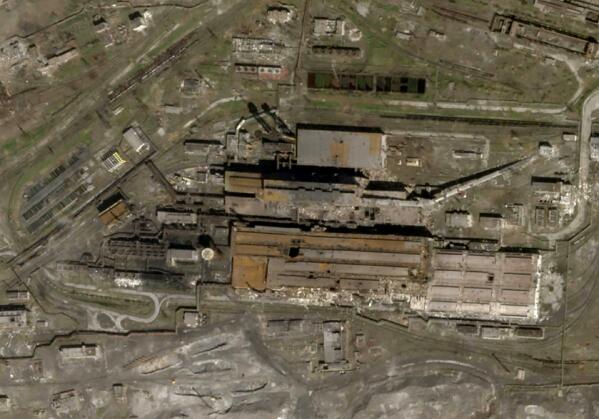 This satellite photo released by Planet Labs and taken on April 20, 2022 shows the Azovstal Steel Plant in Mariupol, Ukraine, with some large holes blasted in the roof. (Planet Labs via AP)